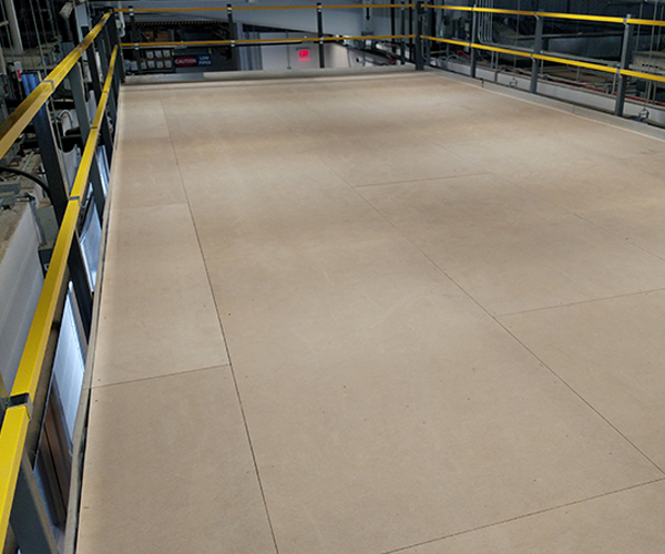 Unfinished ResinDek mezzanine decking panels over corrugated steel deck