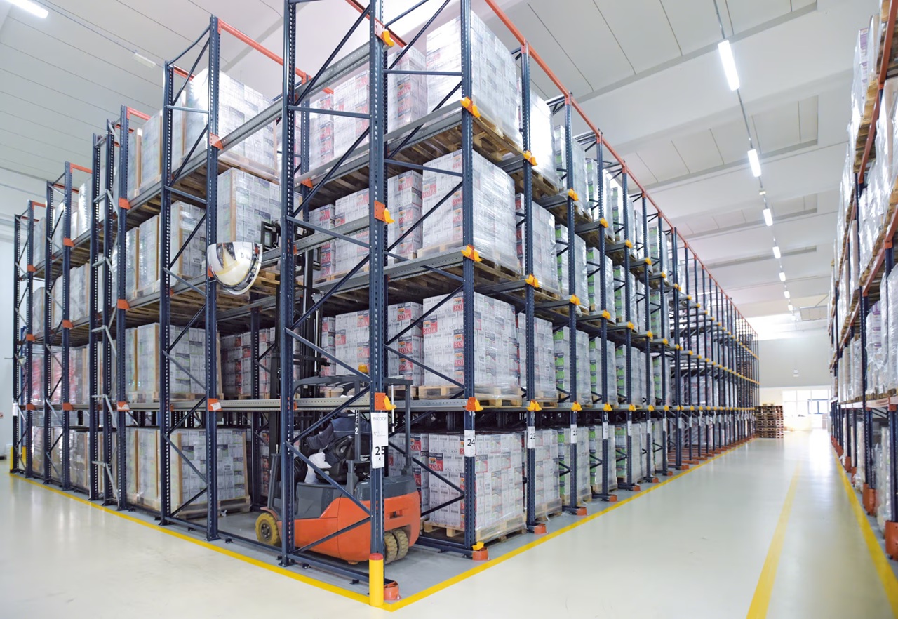 Drive-in rack system with forklift accessing deep storage lanes