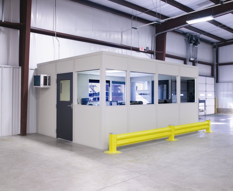 Prefab modular office building in warehouse with windows and door