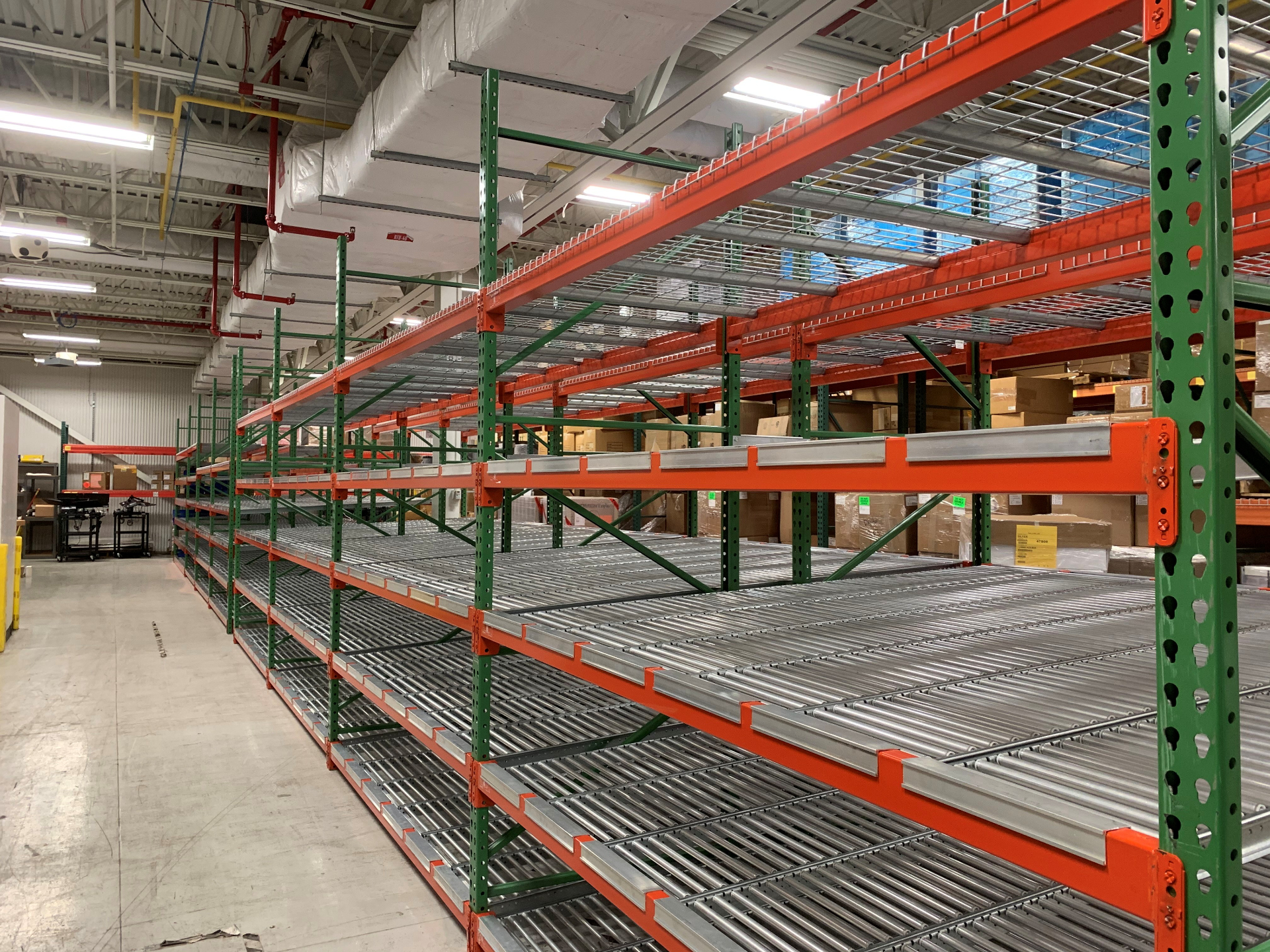 Carton flow rack system with roller lanes installed in Hebron warehouse