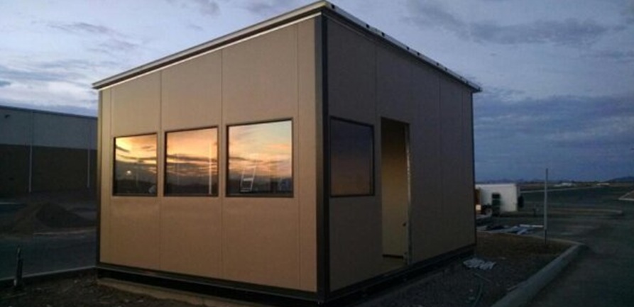 Exterior modular guardhouse with large windows installed at Phoenix AZ facility