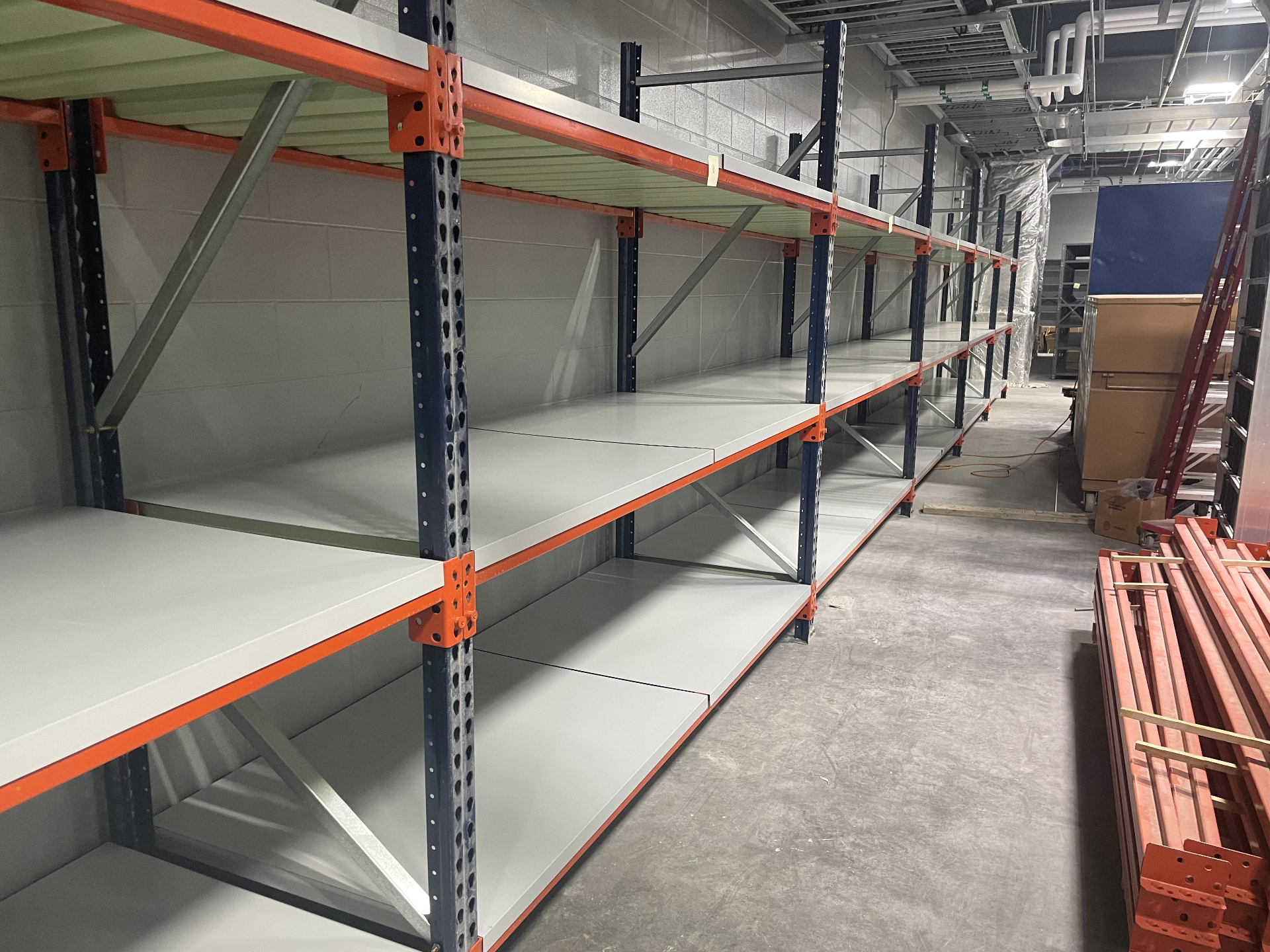 Pallet racking with solid steel decking and blue uprights installed for Koch Foods in Fairfield OH