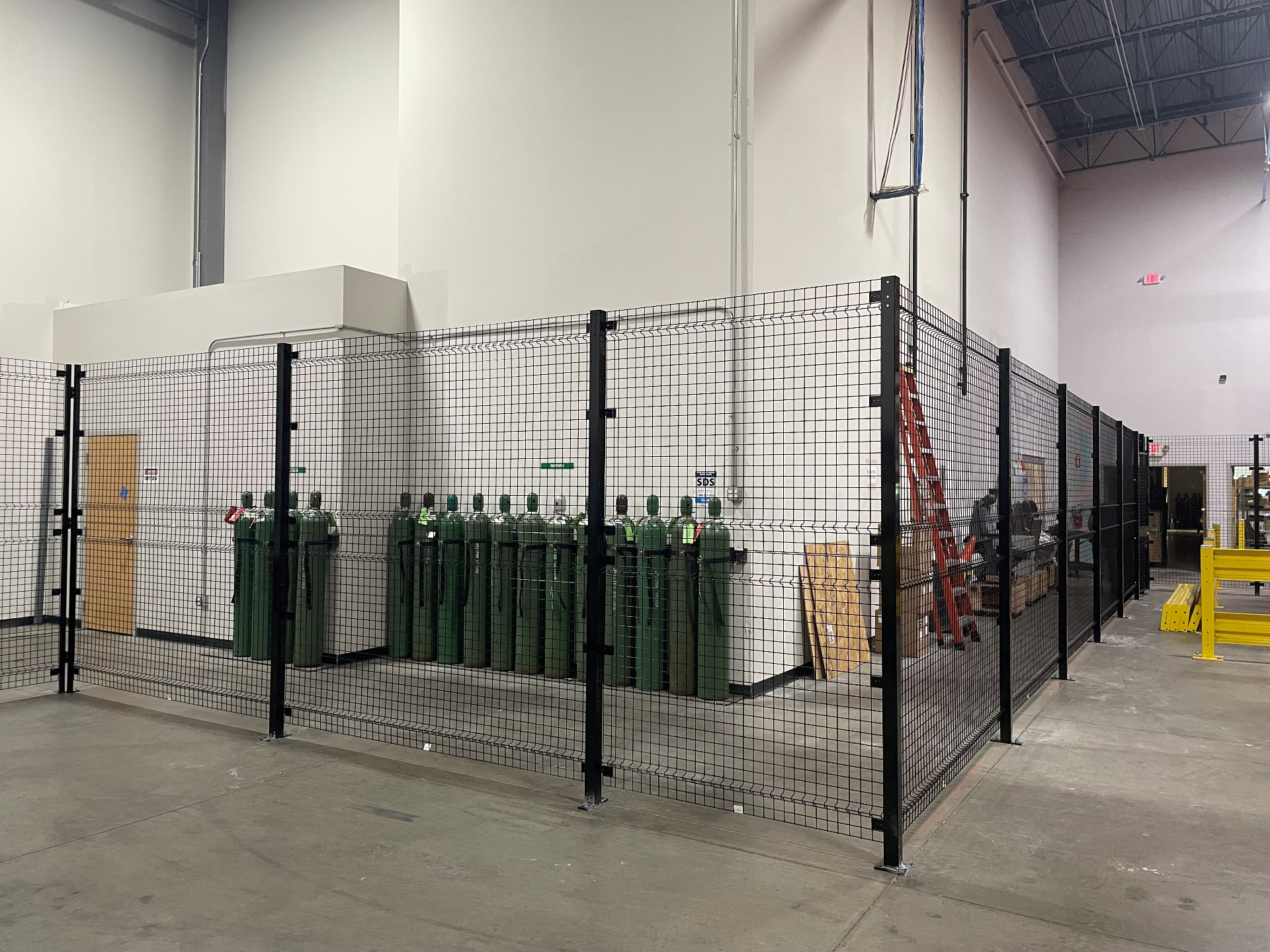 Security wire partition enclosure with gas cylinder storage in Cincinnati warehouse