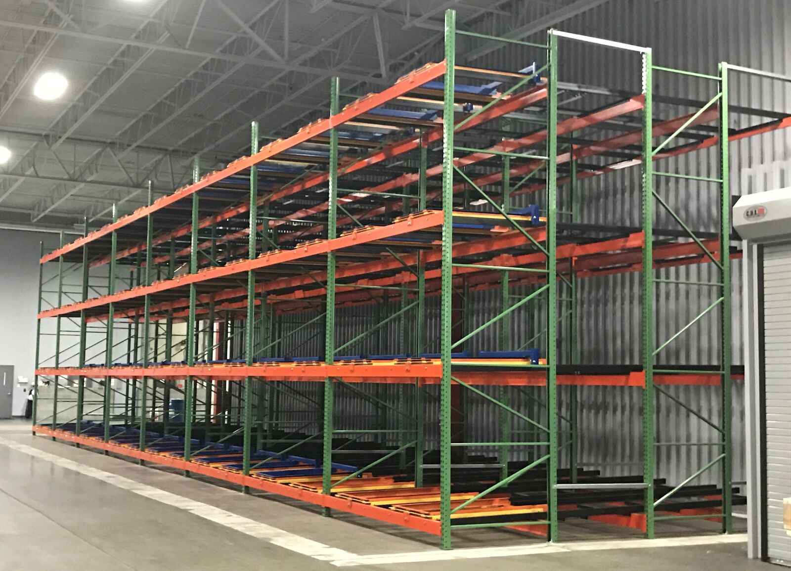Pushback pallet racking for warehouse density